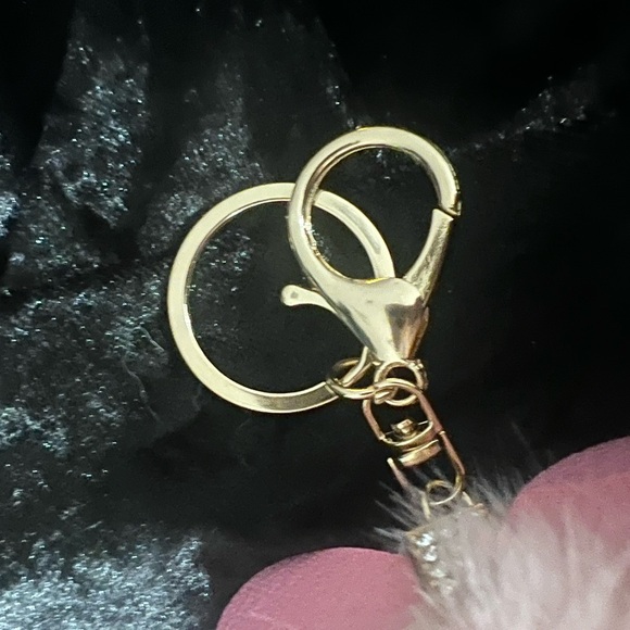 Faux fur keychain. Claw clasp, great quality! Has a set rhinestones on the bow. - Picture 2 of 2